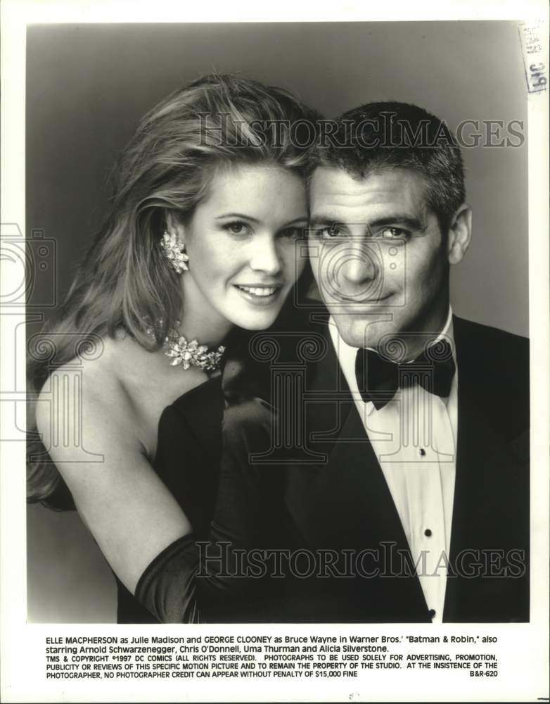 1997 Elle Macpherson and George Clooney in "Batman and Robin" - Historic Images