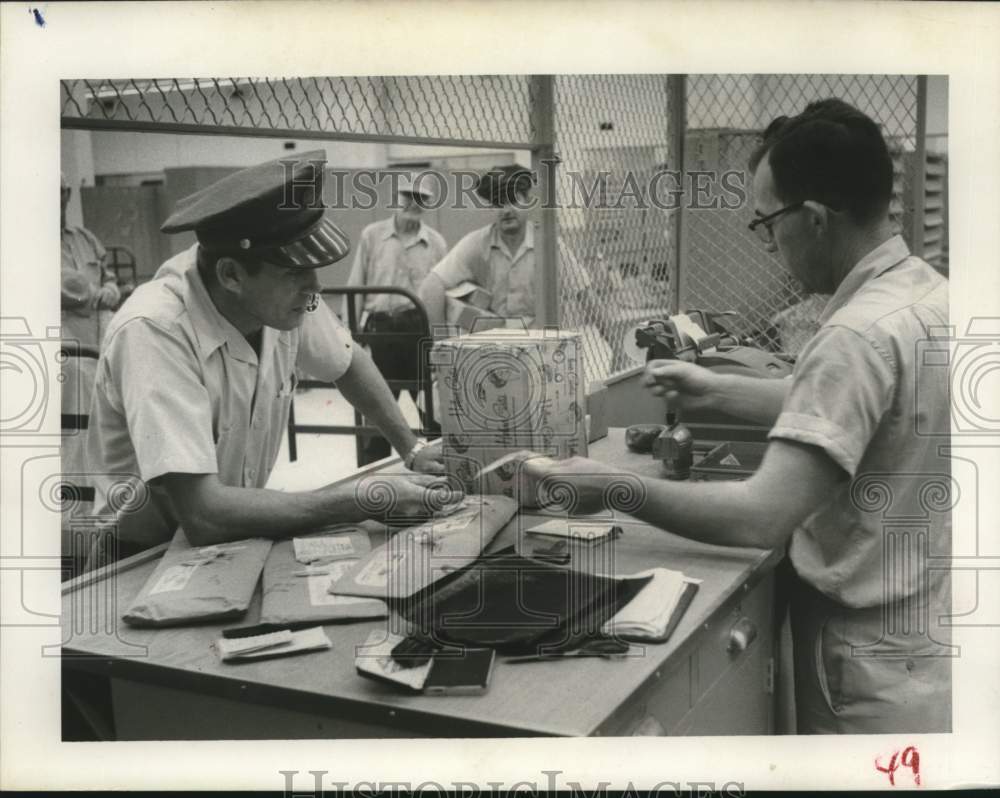 1957 Bruno Mielcarek  pays first postage on package - Historic Images