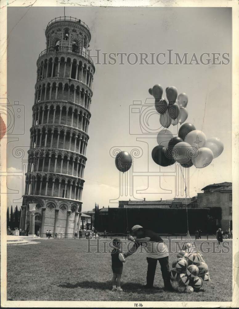 1972 Balloon vendor in front of Leaning Tower of Pisa - Historic Images