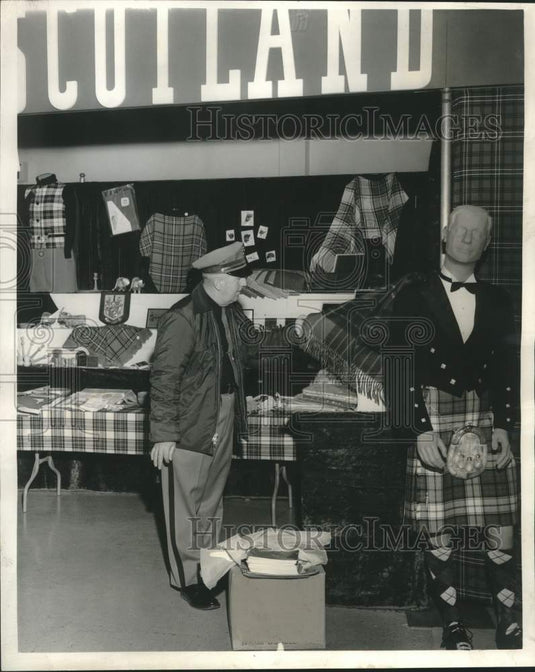 1963 Guard checks goods at Washington State International Trade Fair-Historic Images