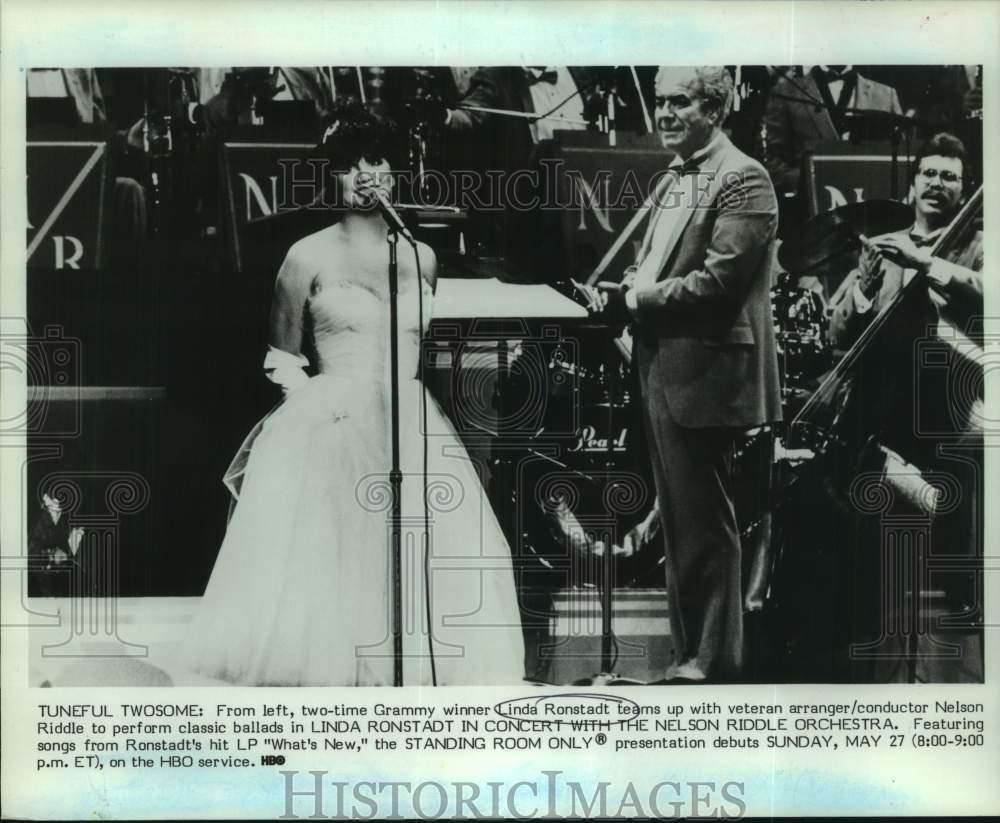 1984 Linda Ronstadt with conductor Nelson Riddle and his orchestra - Historic Images