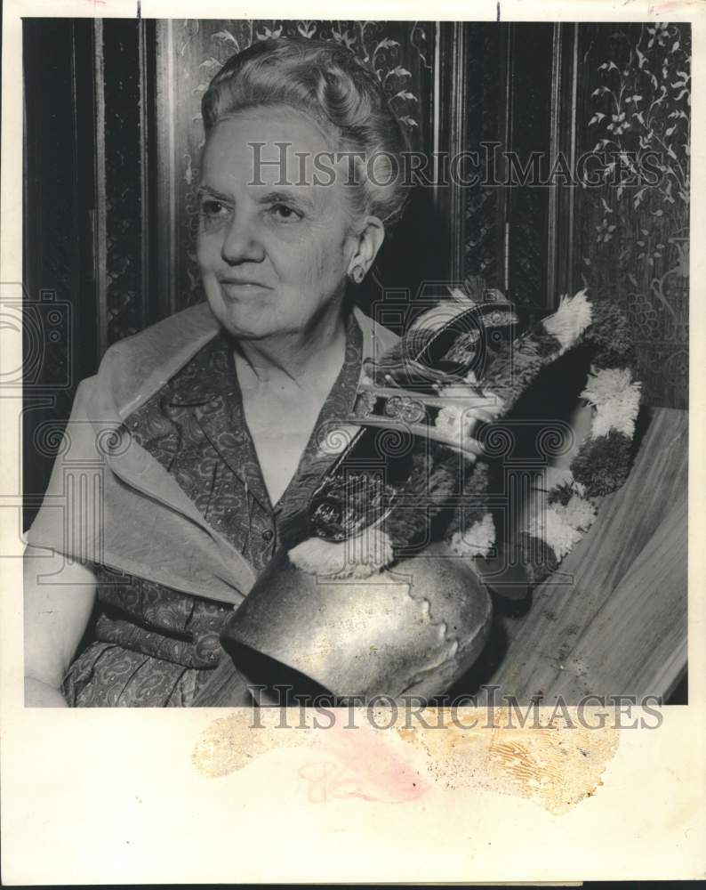 1964 Elizabeth Persons poses with Swiss cow bell-Historic Images