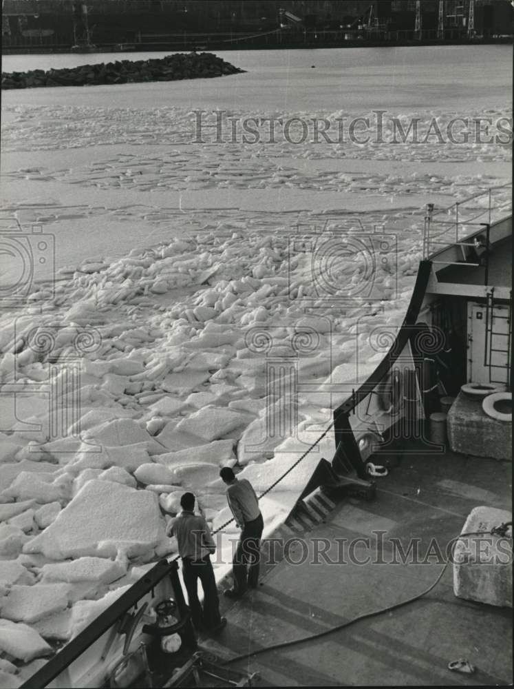 1963 Coast guard Woodrush crew ponder line of ice at Taconite Harbor-Historic Images