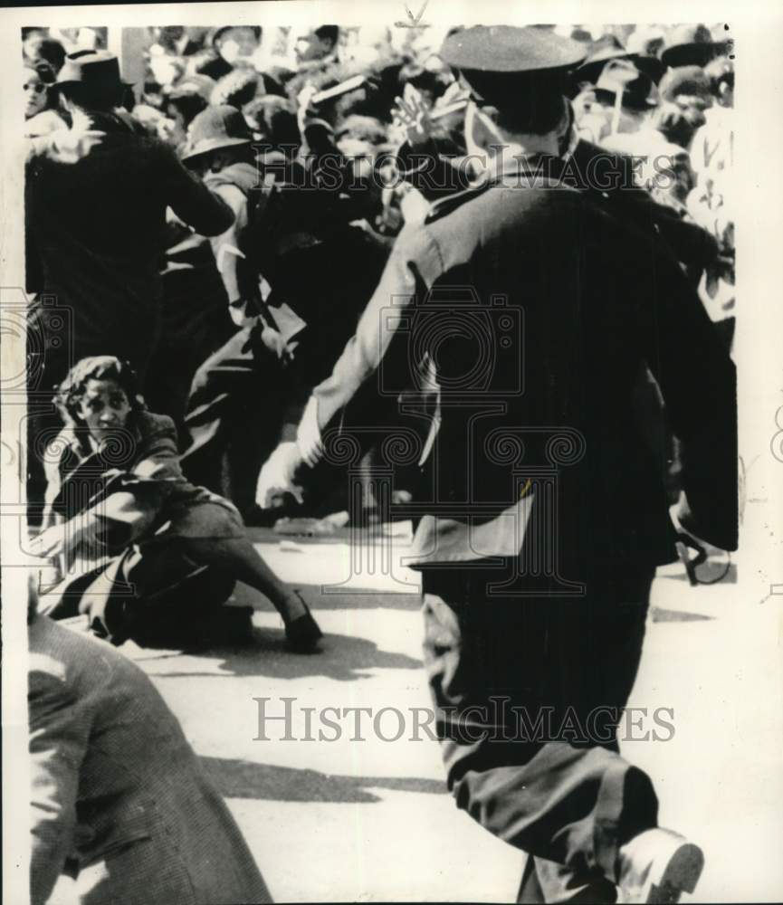 1952 Woman Eyes Charging Officer During Riot at City Hall in Africa-Historic Images