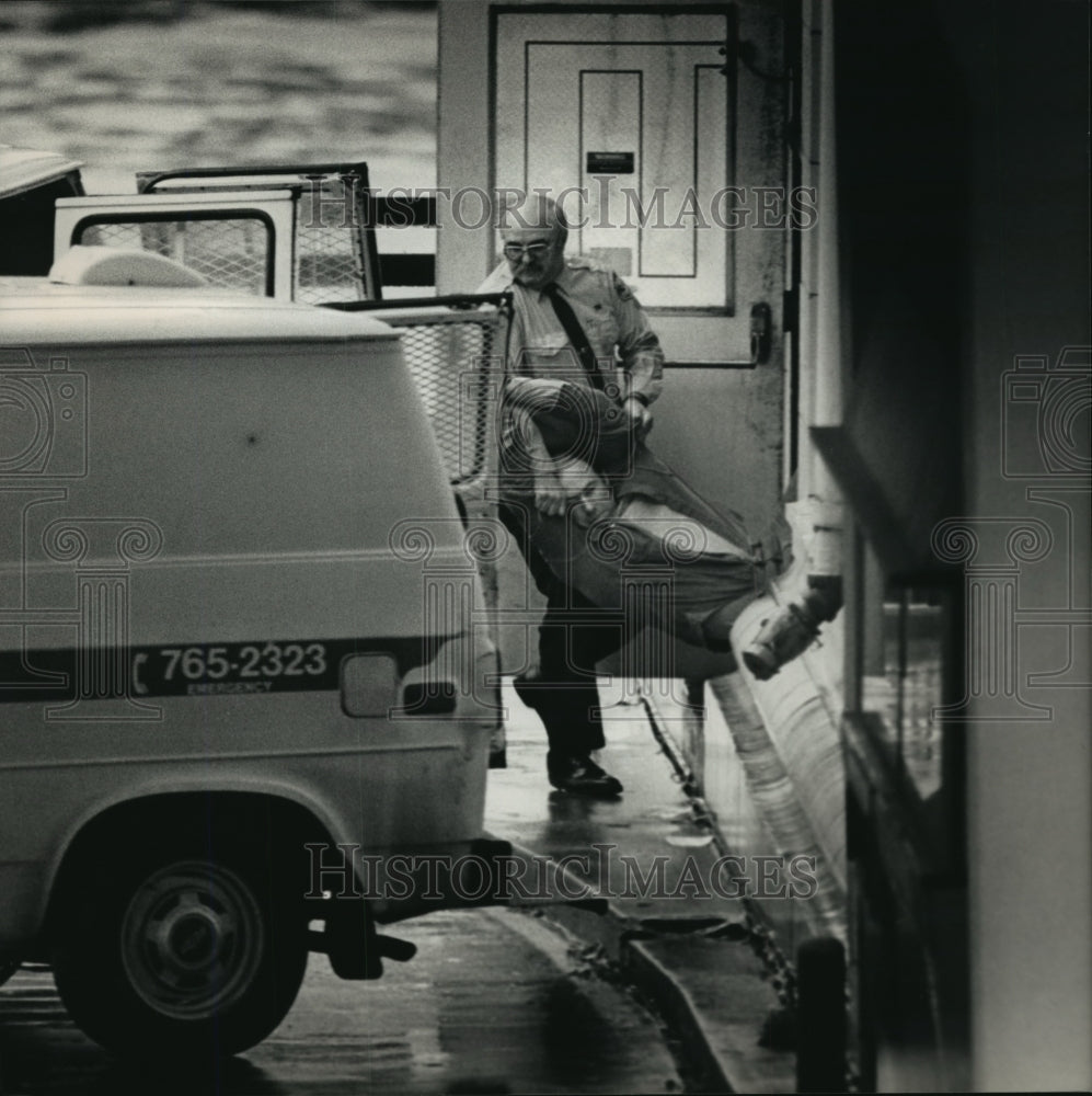 1988 Press Photo Abortion protester carried to a police van after arrest - Historic Images