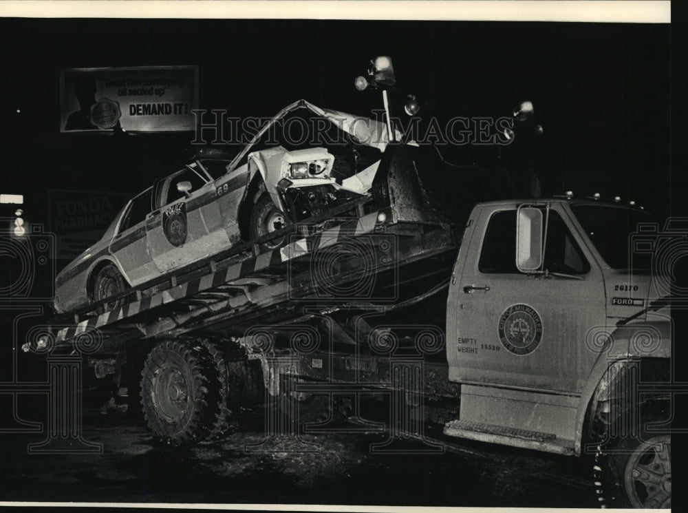 1988 Truck hauled away a damaged Milwaukee squad car at N. 68th St.-Historic Images