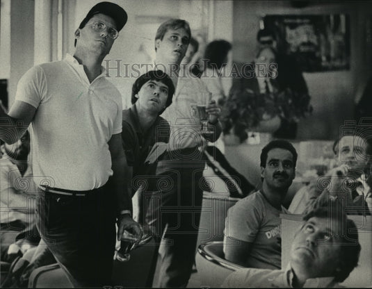 1985 Press Photo Men Watching News on Airline Tragedy - mja02607 - Historic Images