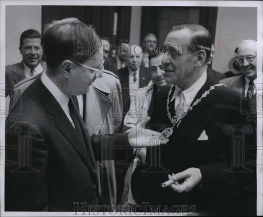 1957 Mayor Ziedler examined Mayor Briscoe's badge of office - Historic Images
