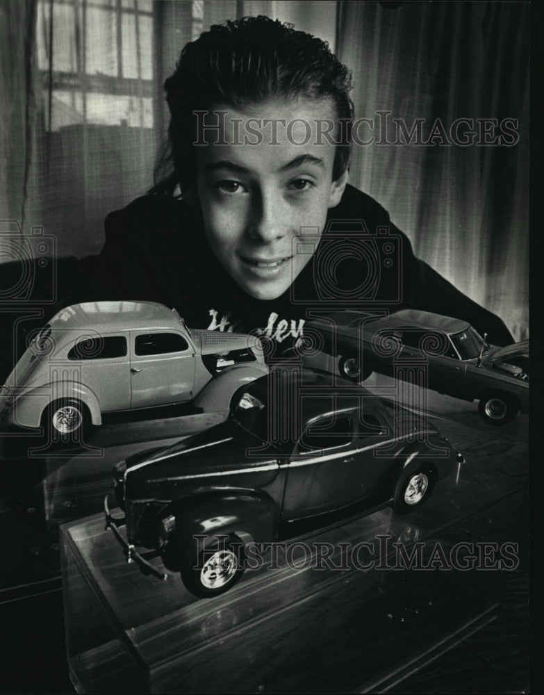 1991 Brad Keller surrounds himself with some of his model cars - Historic Images