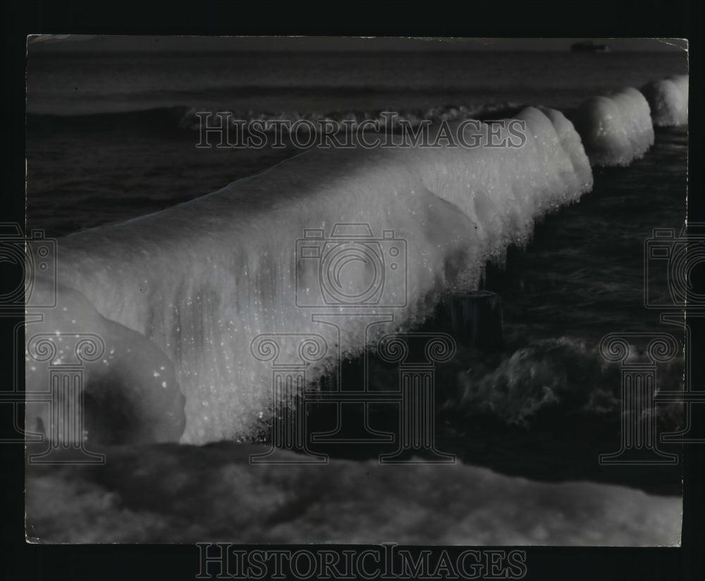 1953 Ice crusted a breakwater near Bradford Beach  - Historic Images