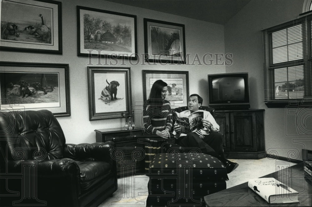 Press Photo John Benson and his daughter Kathleen relax in a room - mja20607 - Historic Images