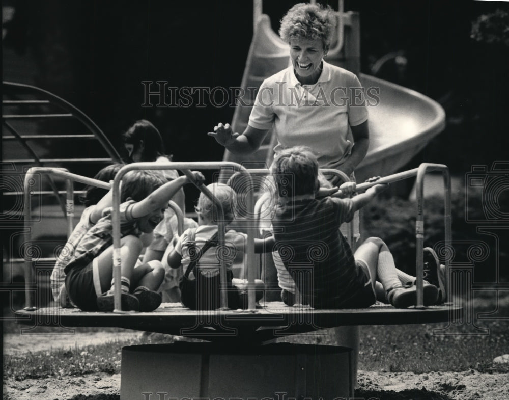 1987 Press Photo Mary Lynn Crisco Using New Donated Playground Equipment - Historic Images