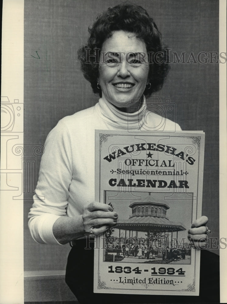 1983 Press Photo Mary Keenan Shows Calendar for Waukesha&#39;s 150th Celebration - Historic Images