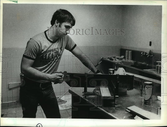 1984 Press Photo Mark Weidmann cutting molding for the Red Raider Room - Historic Images