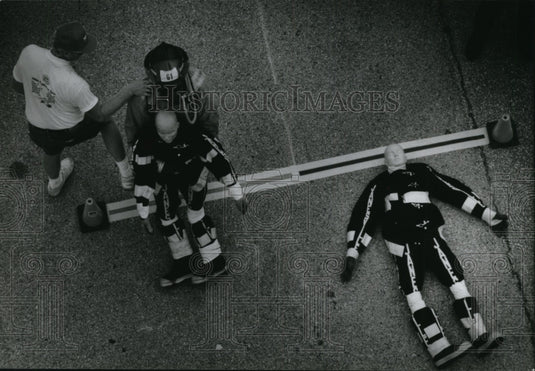 1994 Press Photo Firefighter Jim Muller Drags Dummy in State Fair Rescue Event - Historic Images