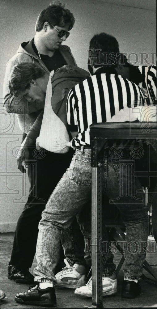 1989 Jim Kennedy Receiving Help After Breaking Arm-Historic Images