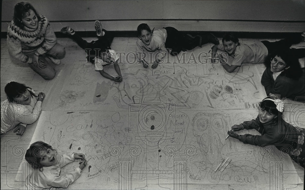 1990 Press Photo Day campers at the YWCA, make a poster to welcome 1991.-Historic Images