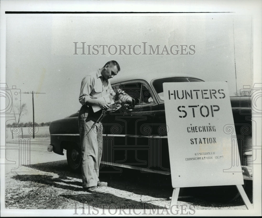 1993 Press Photo Carroll D. Besadny Checks a Pheasant in 1953 - mja40066-Historic Images