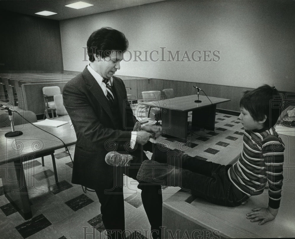 1983 Francisco M. Camacho Ties his Son's Shoe-Historic Images