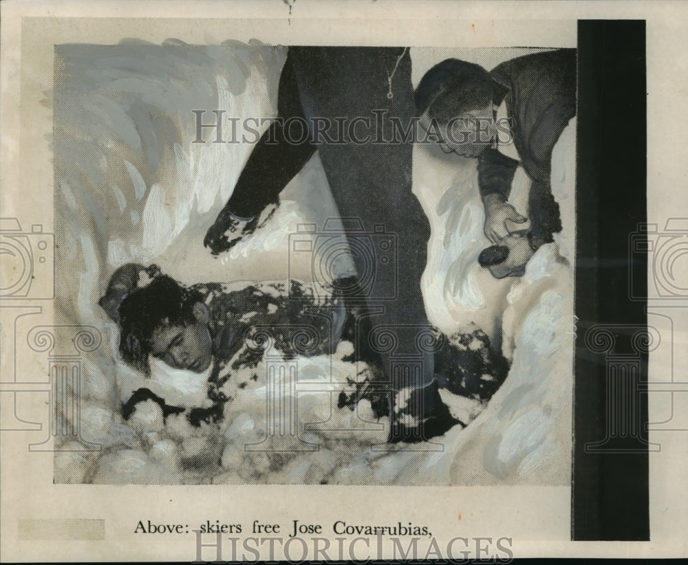 1962 skiers free Jose Covarrubias, buried in snow, from an avalanche - Historic Images