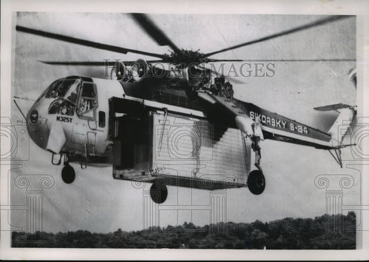 Press Photo Sikorsky S-64 Skycrane Carrying Trailer - mja59548 - Historic Images