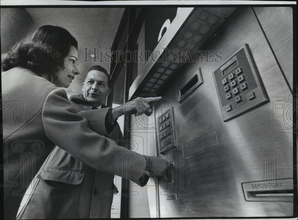 1974 Robert S. Brown Shows Mrs. Edwin Carseth How To Use Auto Teller - Historic Images