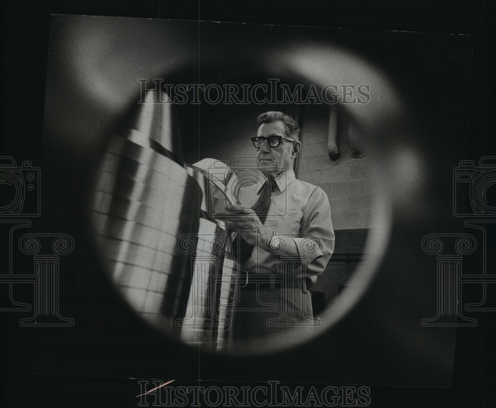 1955 Press Photo Arnold R. Buchholz of Watertown, inspects parts for Brandt Inc. - Historic Images