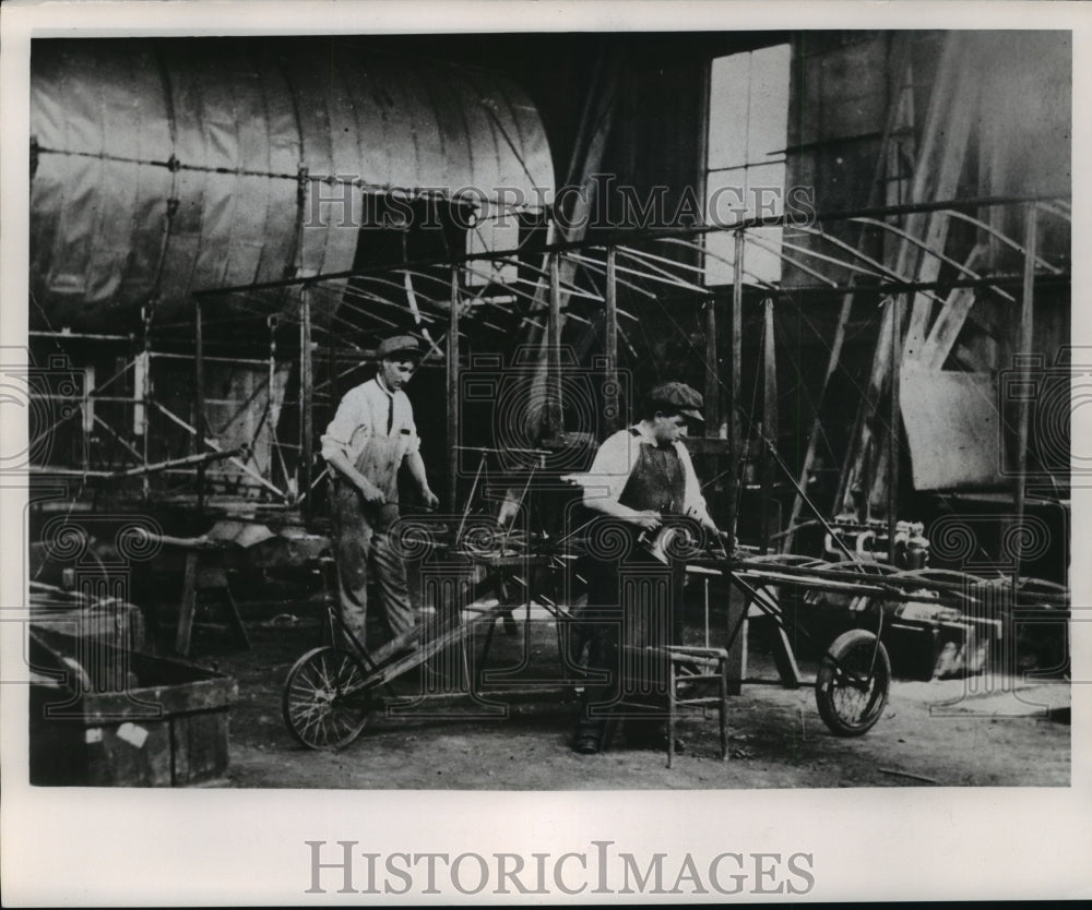 1953 Press Photo Edward Bryant and Otto Walters Working On Curtiss Type Machine-Historic Images