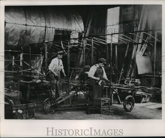 1953 Press Photo Edward Bryant and Otto Walters Working On Curtiss Type Machine-Historic Images