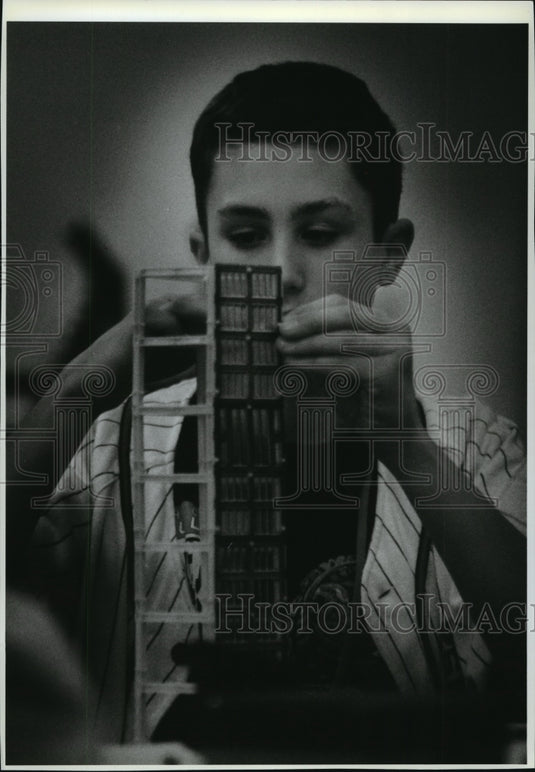 1993 Justin Ellis builds a model building in a steel frame-Historic Images
