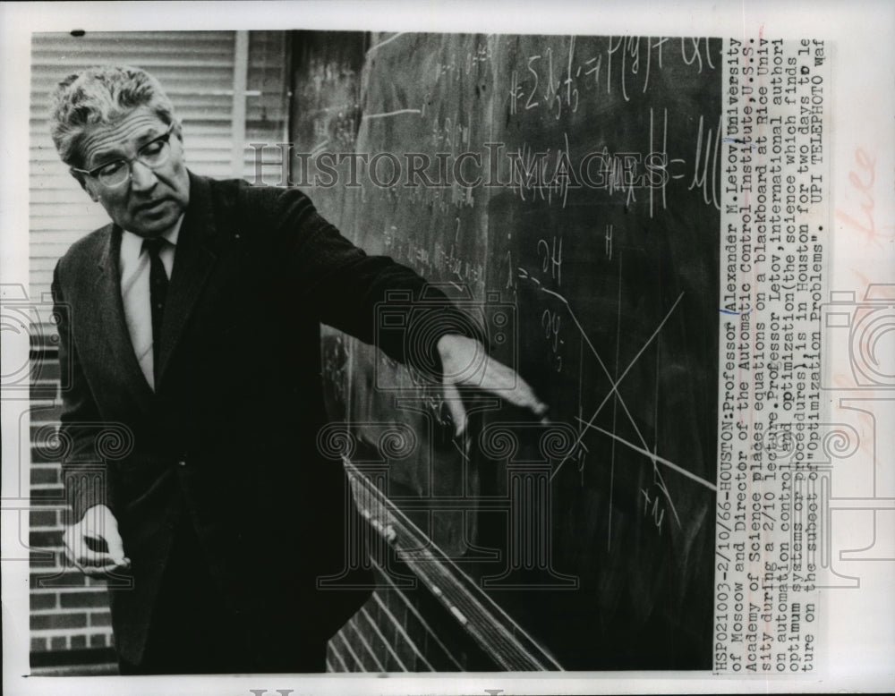 1960 Press Photo Professor Alexander M. Letov writes equations on the board - Historic Images