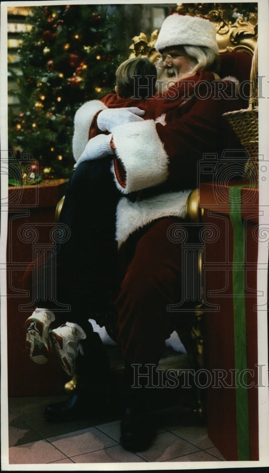 1992 Santa Claus Receiving a Hug From a Child-Historic Images