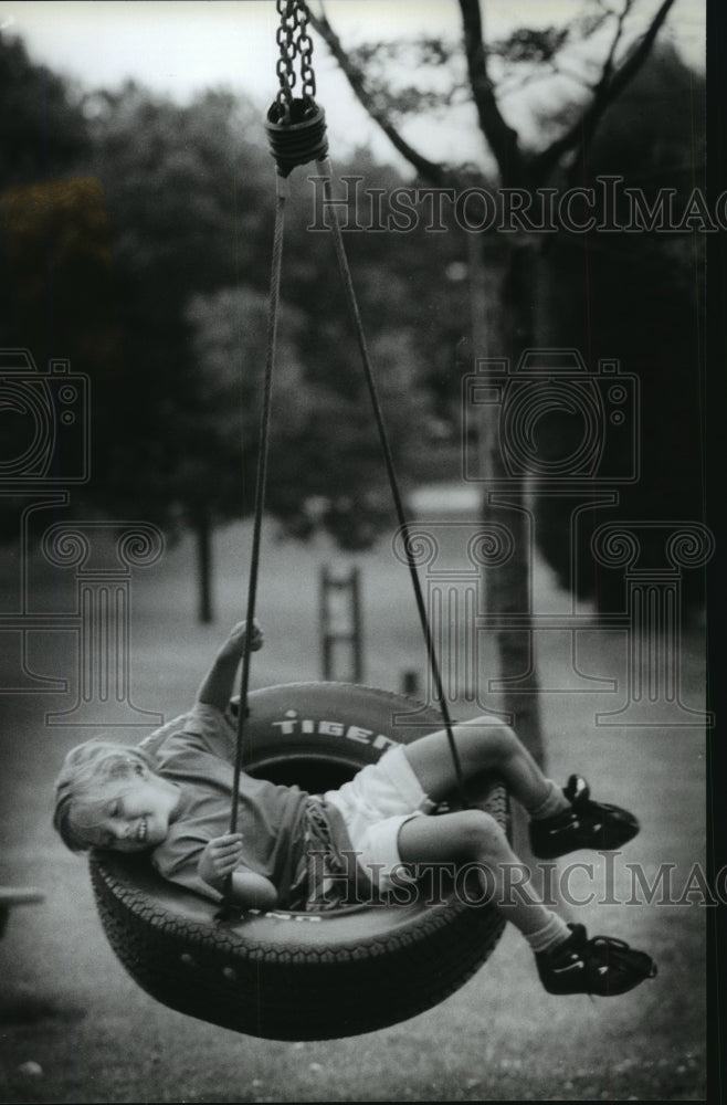 1994 Press Photo Breanne Bian on Swing at Centennial Park in Cedarburg Wisconsin - Historic Images