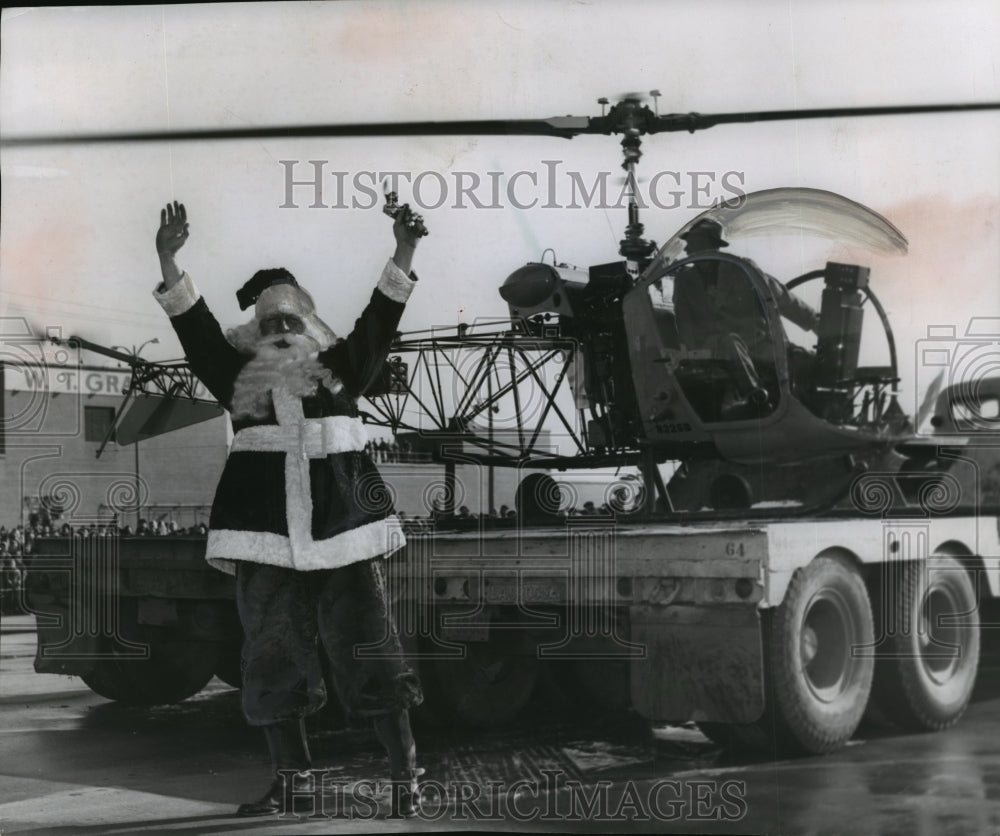 1956 Santa Claus waves cheery greeting to thousands who greeted him.-Historic Images