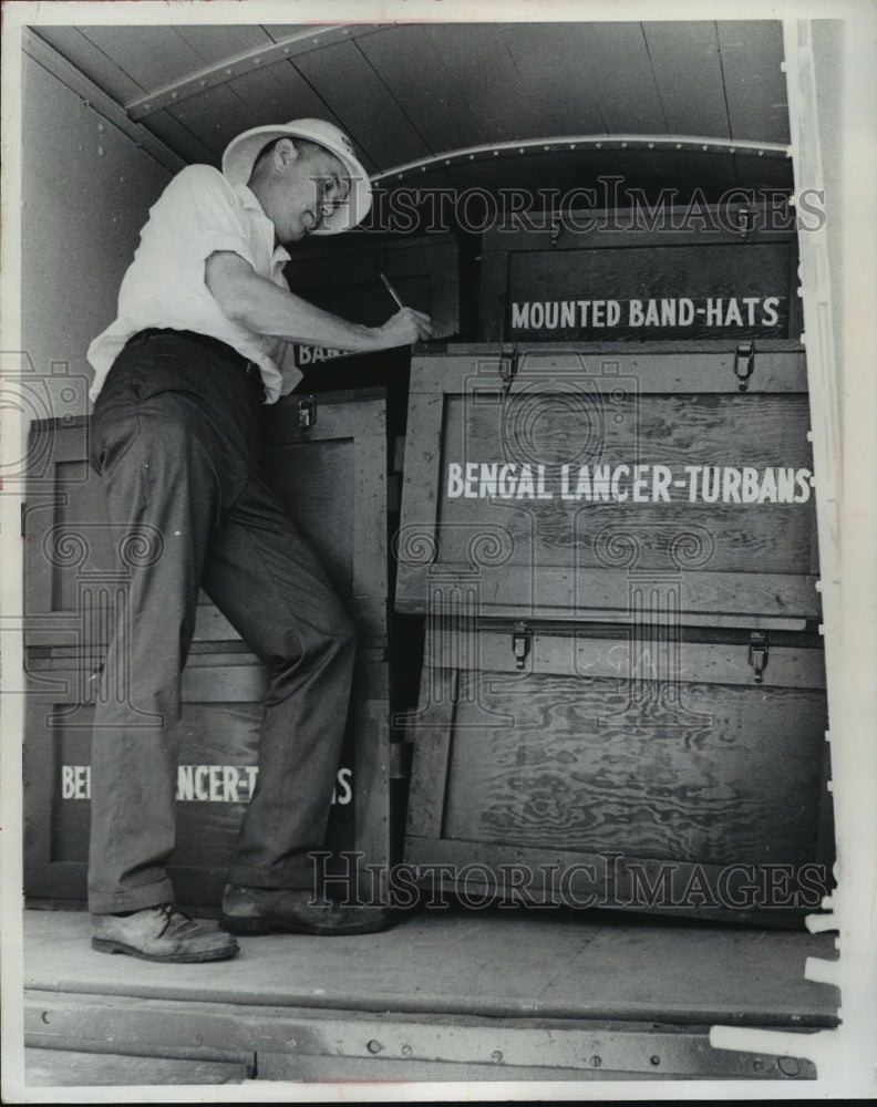 1967 Press Photo Robert Parkinson Checks His Costume List Before Shipping Them - Historic Images