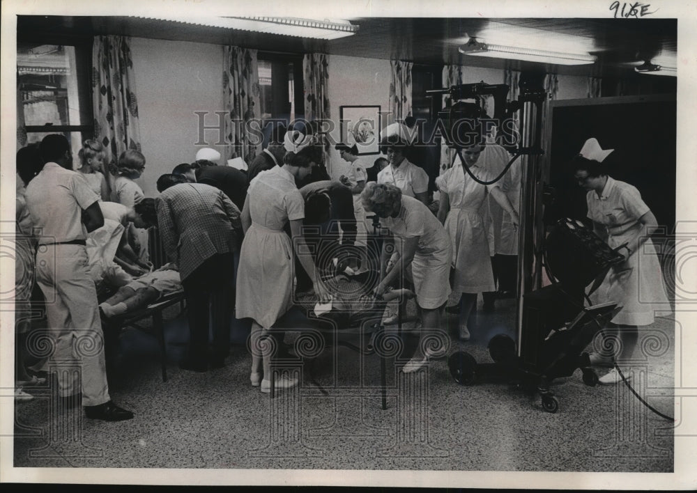 1964 Press Photo Doctors &amp; Nurses Working on &quot;Patients&quot; at St. Joseph&#39;s Hospital - Historic Images