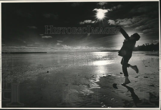 1984 Stone Tossed Onto Frozen Area Of North Bay by Jeremy Gretzinger - Historic Images