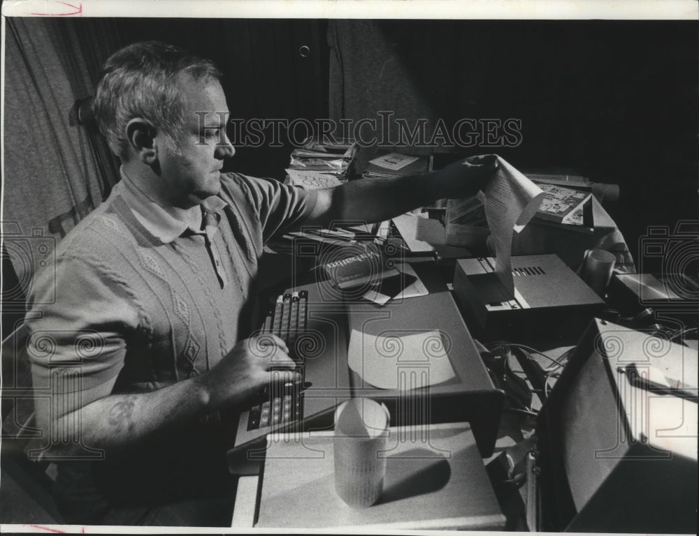1977 Kenneth Struck operated a computer in his recreation room.-Historic Images