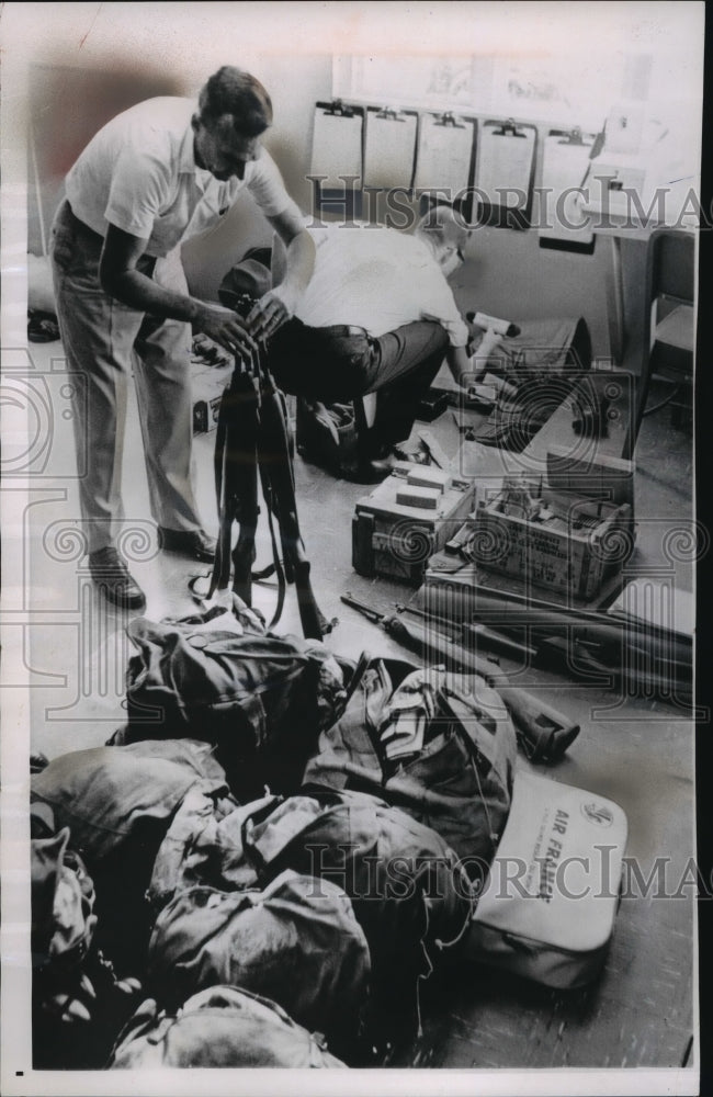 1962 Press Photo Customs Agents Take Inventory of Weapons Found in Cuban Boat - Historic Images