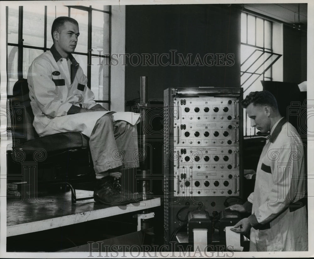 1956 Press Photo test engineer use electronic recording instrument on technician-Historic Images