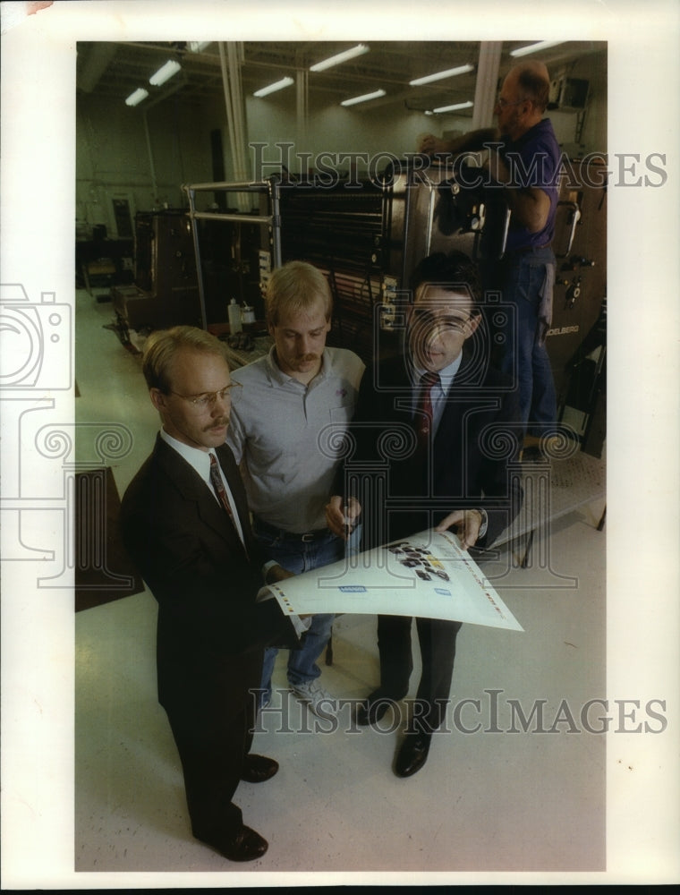 1992 Press Photo Todd Meissner, John Becker and John Cance view printing proof-Historic Images