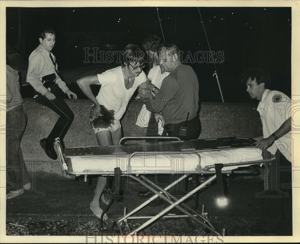 1988 Press Photo Gordon Veldman of Holland Mich. was helped to a Stretcher-Historic Images
