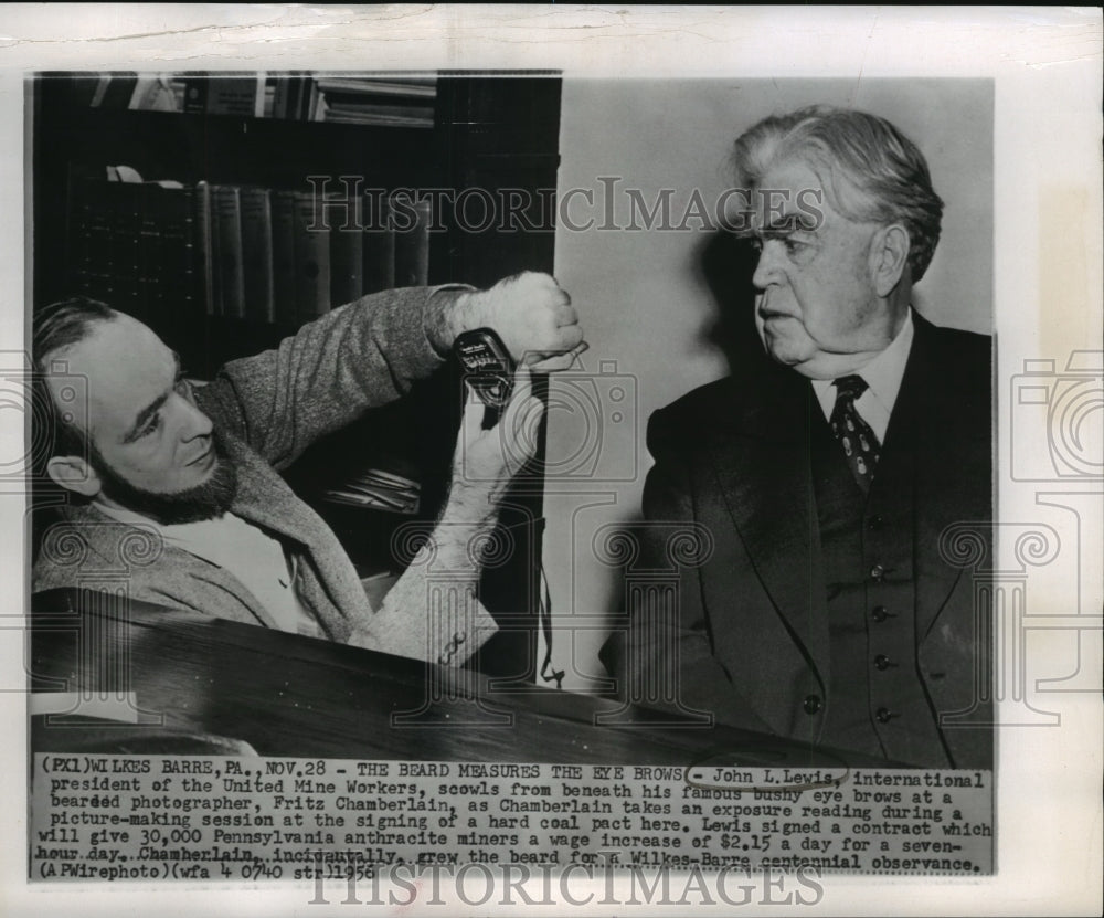 1956 Press Photo John L. Lewis, scowls his bushy eye brows at Fritz Chamberlain.- Historic Images
