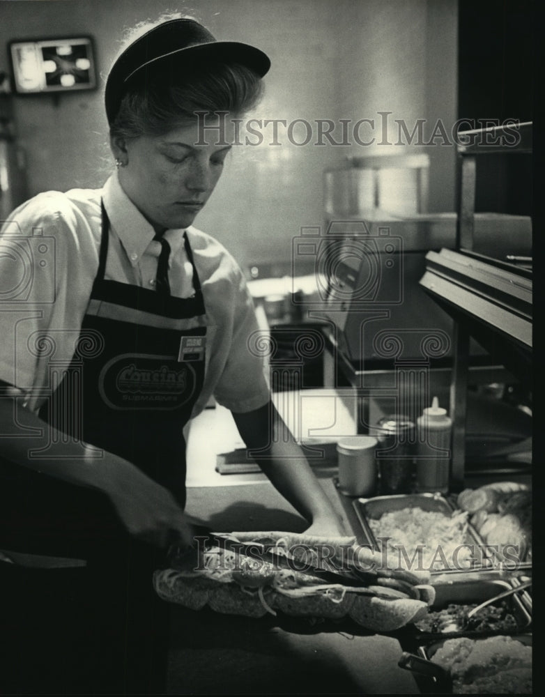 1987 Cheri Dohse puts finishing touches on a Cousins Special Sub-Historic Images