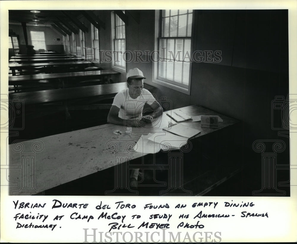 1980 Press Photo Ybrian Duarte del Toro sitting at Dining Facility at Fort McCoy - Historic Images