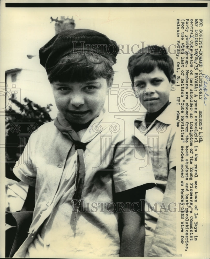 1975 in central Cuba, a schoolgirl wears insignium of Young Pioneers-Historic Images