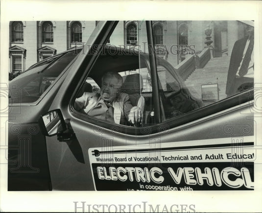 1982 Wisconsin Governor Lee Dreyfus tries out an electric car - Historic Images
