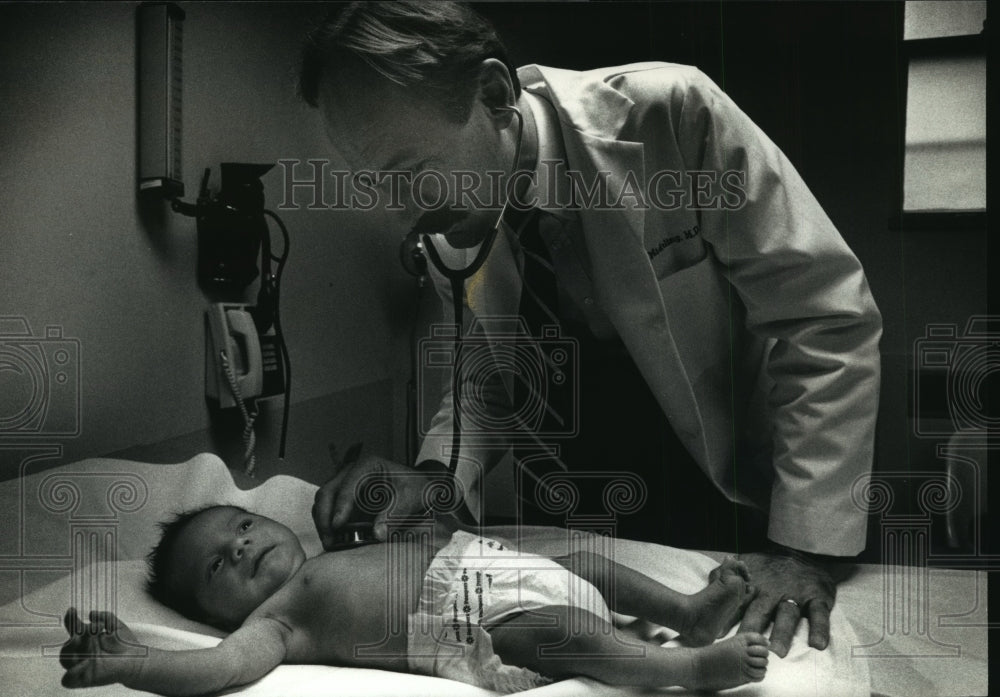 1991 Press Photo Doctor and Baby - mja95529 - Historic Images