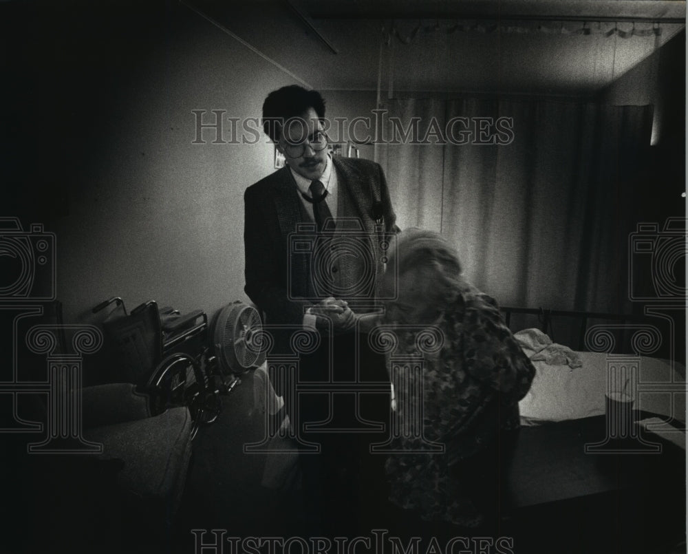 1991 Ray J. Zastrow, family practitioner,  works with Ann Dejanovich - Historic Images
