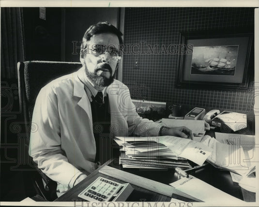 1986 Dr. Lester Bickford behind the desk at his office in Fredonia-Historic Images